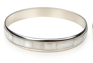 Silver bracelet with a white inset on a white background